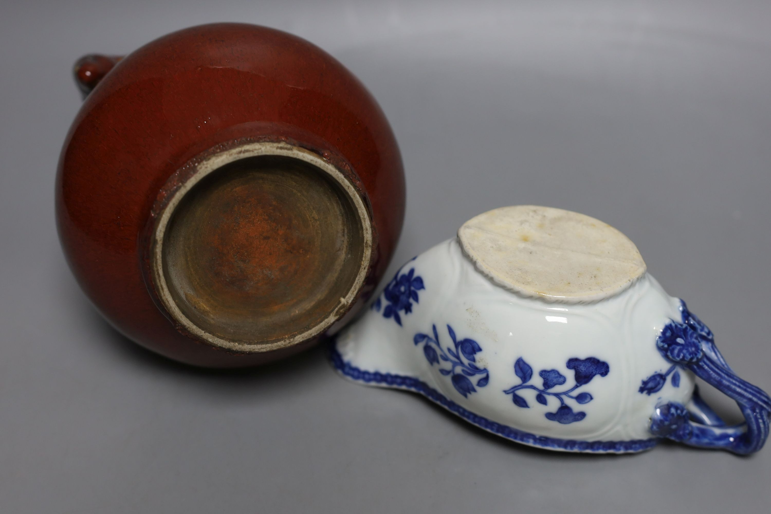 An 18th century Chinese export tea cup, 3 pieces of export blue and white and a sang de boeuf vase. Tallest 16cm